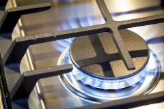 Stove top burner with blue natural gas flame
